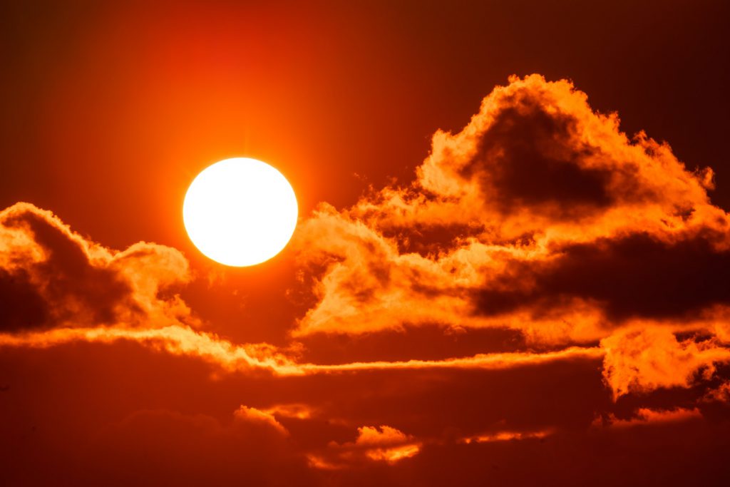 Sky with sun in clouds of altitude. Cloud the evening sky at sunset