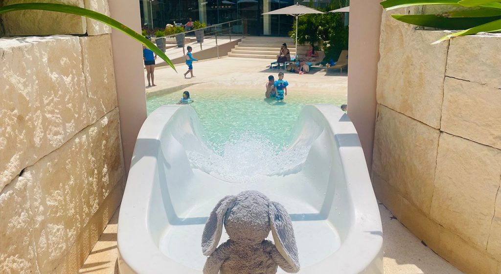 marley goes down the water slide