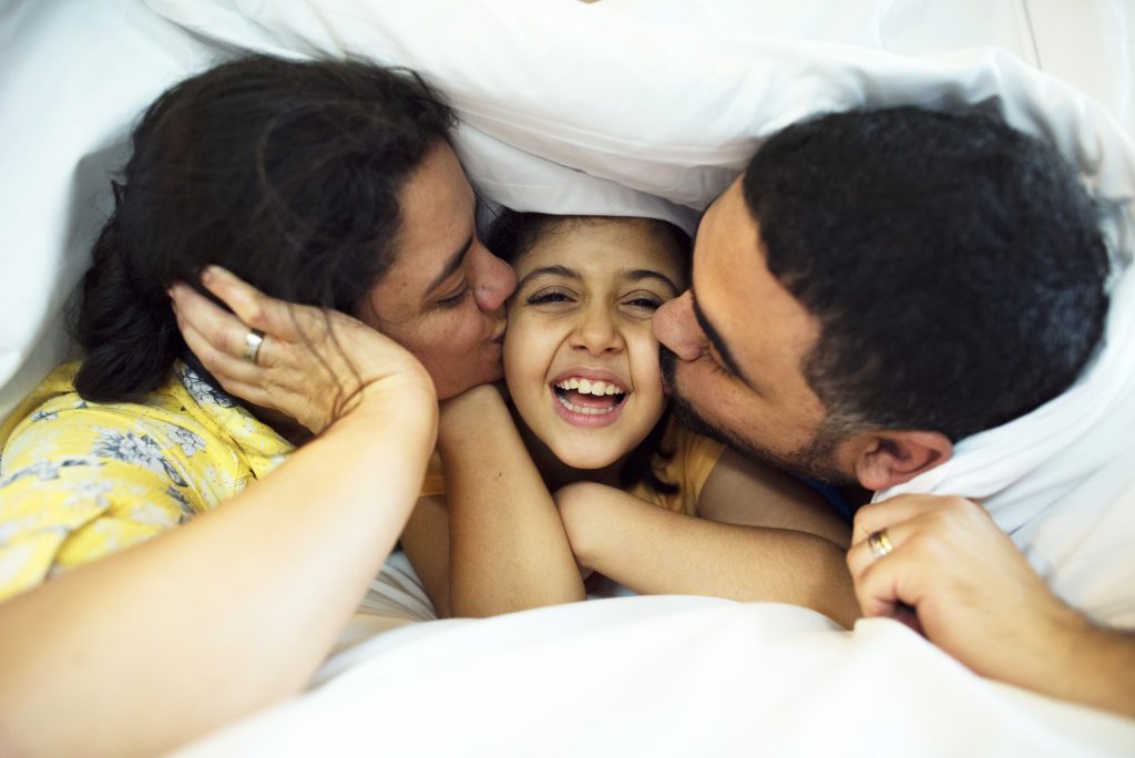 Brazilian parent playing with daughter