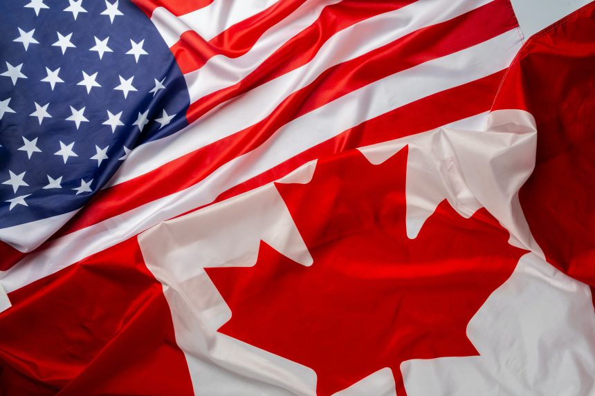 Flags of Canada and USA folded together